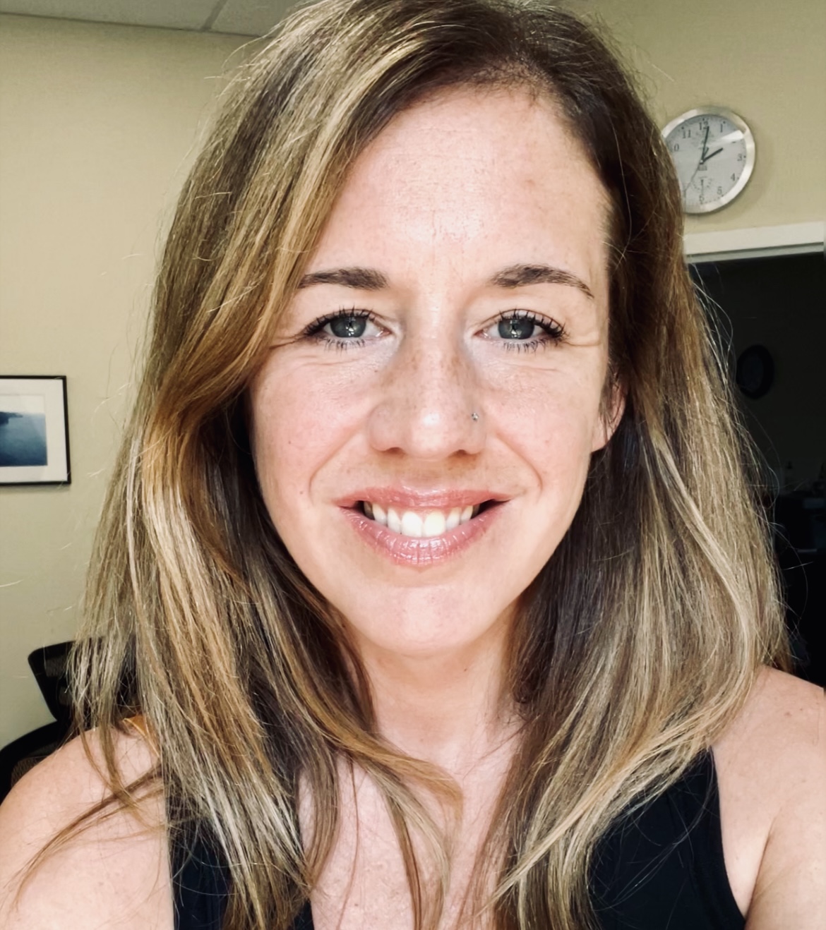 Kathleen Paine, LICSW (she/her) smiling warmly